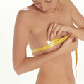 Woman measuring her breast