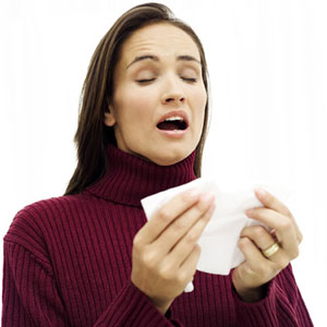 Woman sneezing