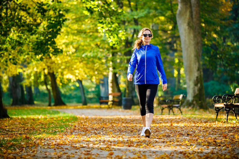 Middle-aged woman walking in the park