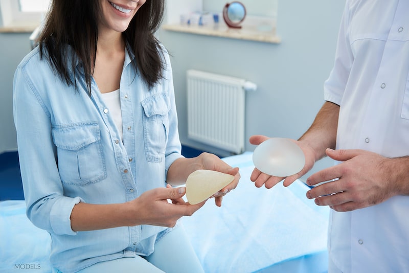 A woman looking at her breast implant options.