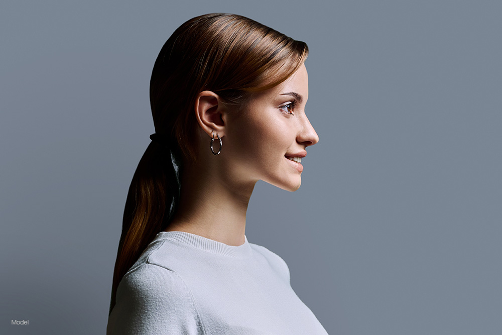 Profile of a young woman in a white shirt