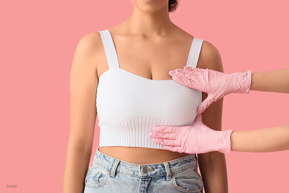 Woman in a white shirt having her breast examined 